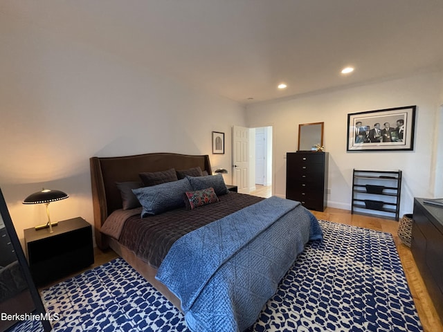 bedroom with hardwood / wood-style floors