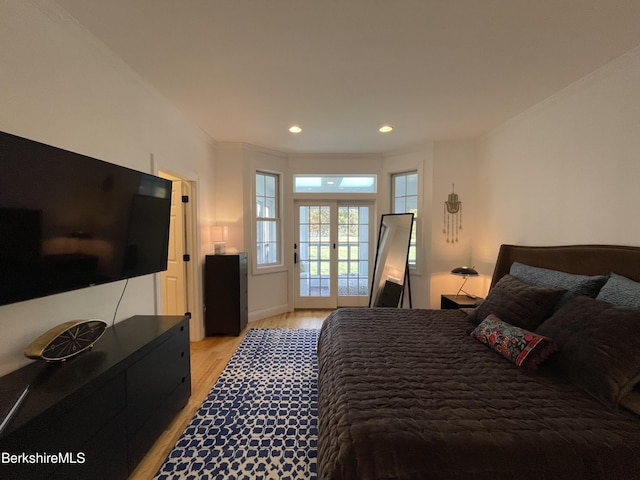 bedroom featuring light hardwood / wood-style floors and french doors