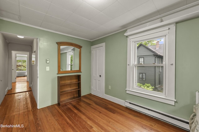9 High St, Lenox, MA 01240 - unfurnished room featuring a baseboard radiator, hardwood / wood-style flooring, healthy amount of natural light, ornamental molding, and radiator