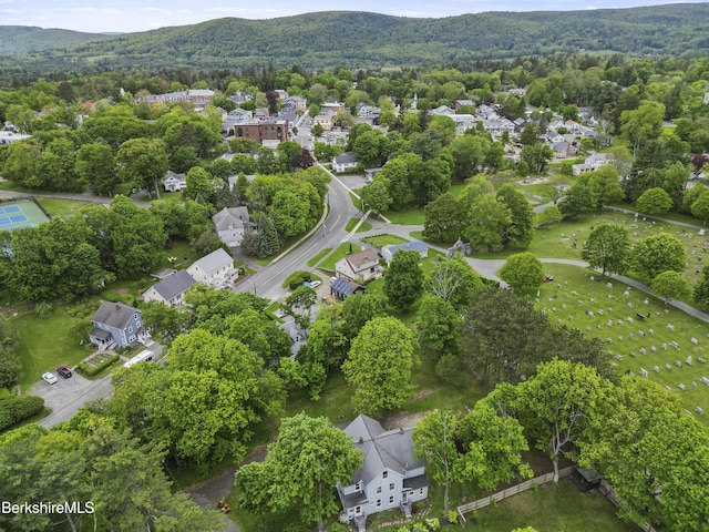 9 High St, Lenox, MA 01240 - aerial perspective of suburban area with a heavily wooded area and mountains
