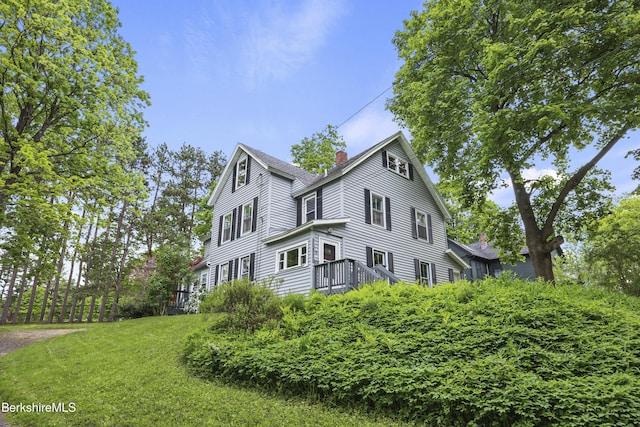 9 High St, Lenox, MA 01240 - view of property exterior with a chimney, a yard, and a wooden deck