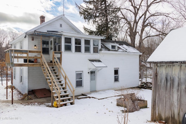 view of snow covered house