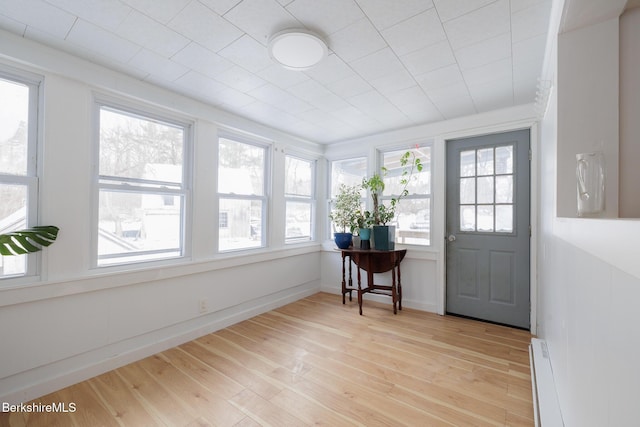 sunroom featuring baseboard heating