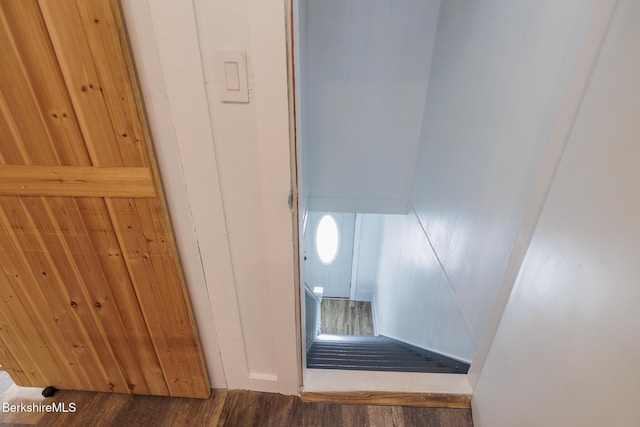 stairway featuring hardwood / wood-style floors