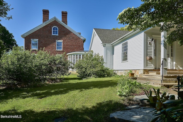 view of home's exterior featuring a lawn