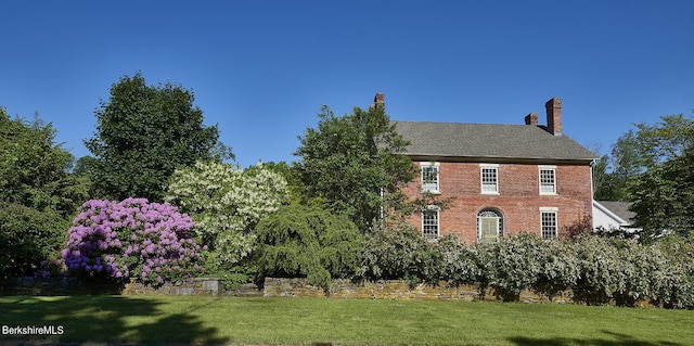 view of home's exterior featuring a yard