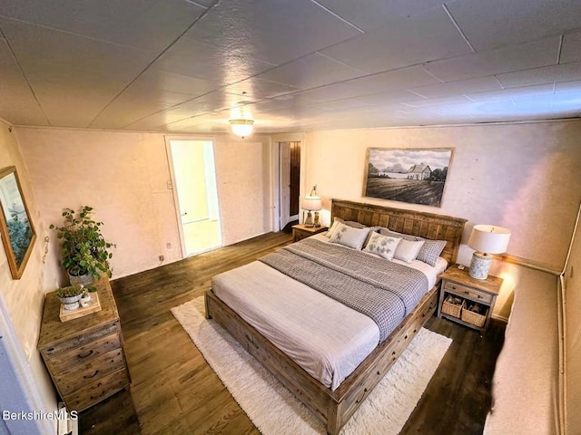 bedroom featuring wood finished floors