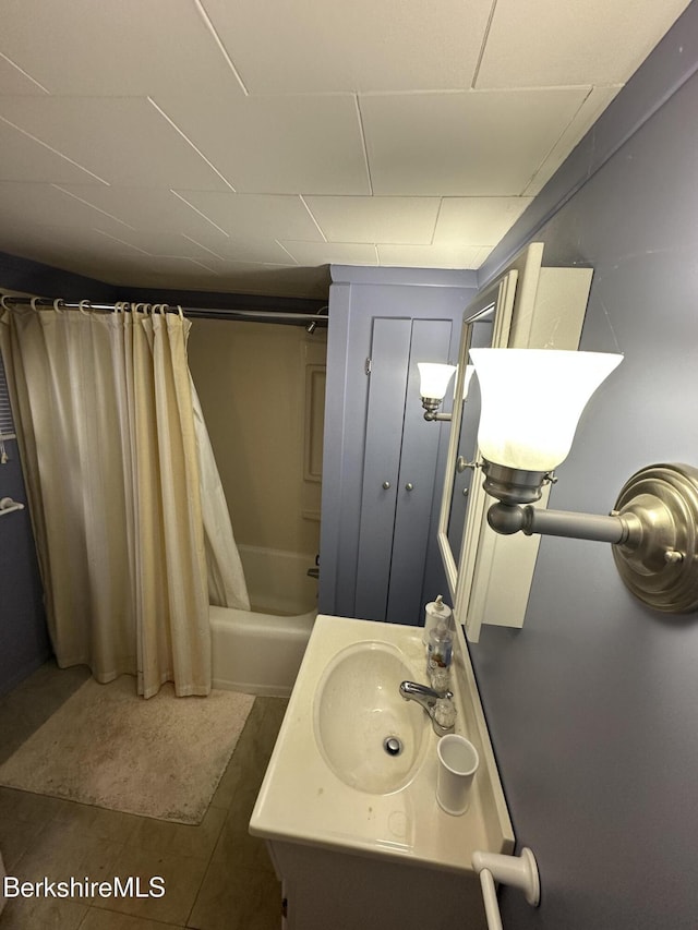 full bath featuring shower / tub combo with curtain and vanity