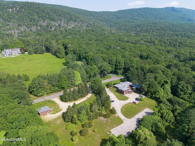 2049 S Undermountain Rd, Sheffield, MA 01257 - aerial overview of property's location with a heavily wooded area and a mountainous background