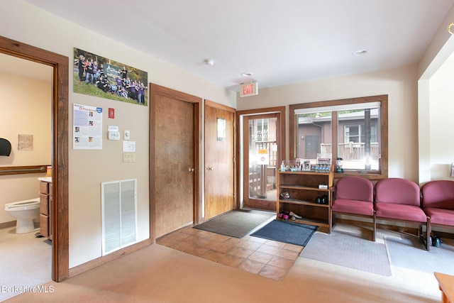 2049 S Undermountain Rd, Sheffield, MA 01257 - foyer featuring carpet and tile patterned flooring