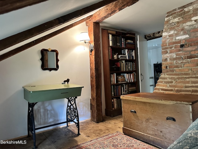 interior space featuring vaulted ceiling with beams