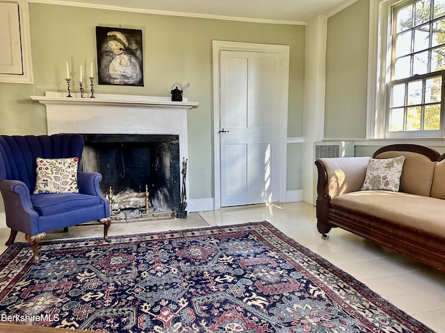 sitting room featuring crown molding and a wealth of natural light