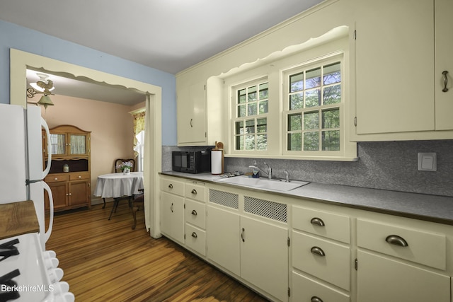 21 Furnace Rd, Richmond, MA 01254 - kitchen with freestanding refrigerator, black microwave, backsplash, dark wood-type flooring, and a sink