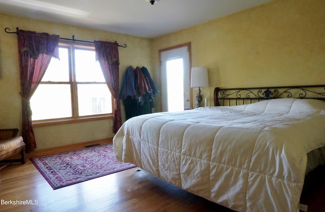 bedroom featuring hardwood / wood-style flooring