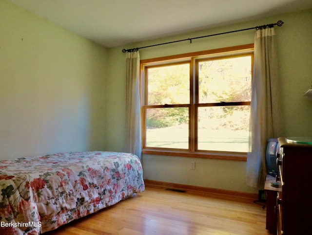 bedroom with light hardwood / wood-style floors