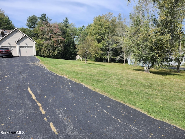 view of yard with a garage