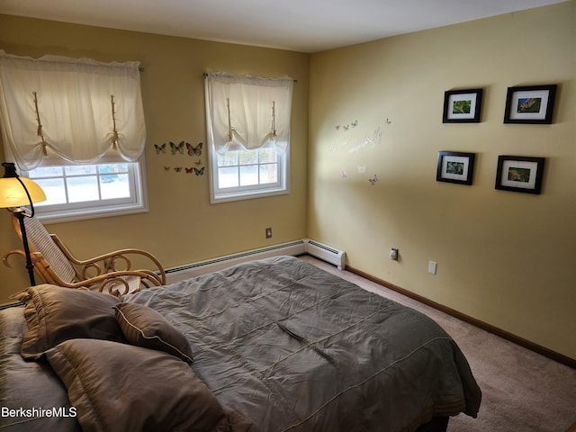 bedroom featuring a baseboard heating unit and carpet flooring