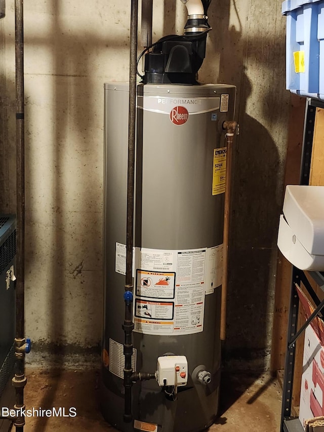 utility room featuring water heater