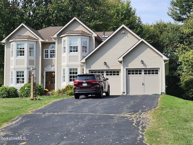 view of front facade featuring a garage and a front yard