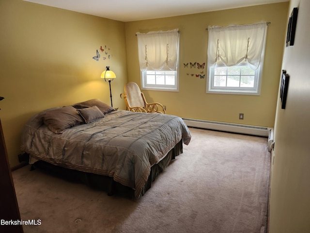 carpeted bedroom featuring a baseboard radiator