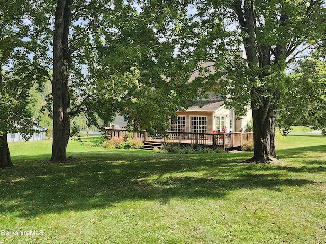 view of yard with a wooden deck