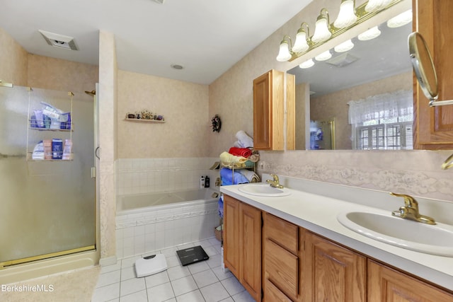 bathroom featuring tile patterned flooring, vanity, and independent shower and bath