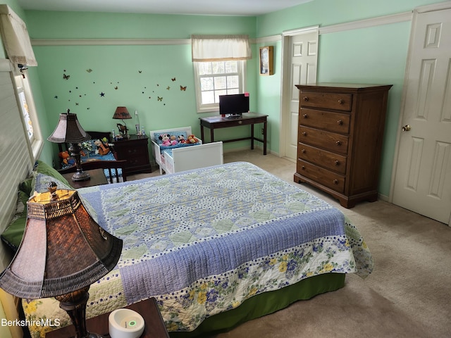 bedroom with light carpet