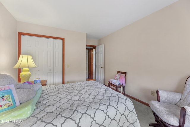 bedroom with carpet and a closet