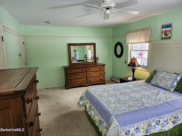 bedroom featuring light carpet, ceiling fan, and baseboard heating