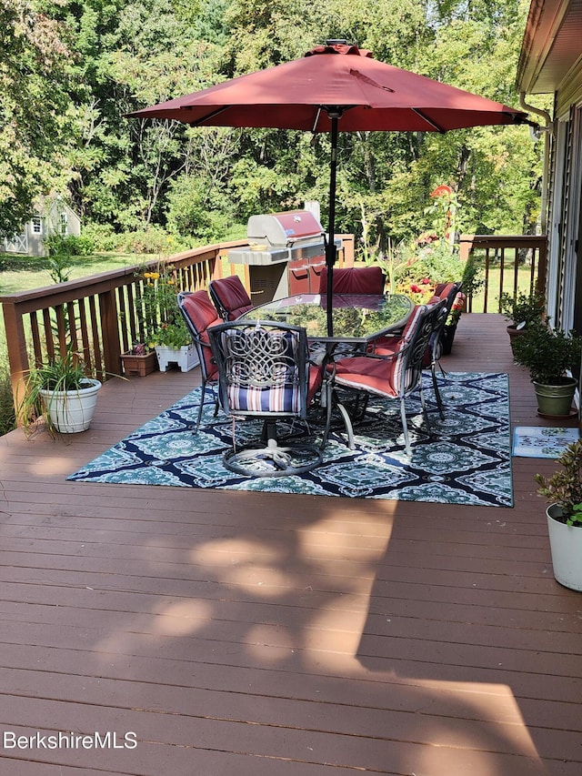 wooden terrace with area for grilling