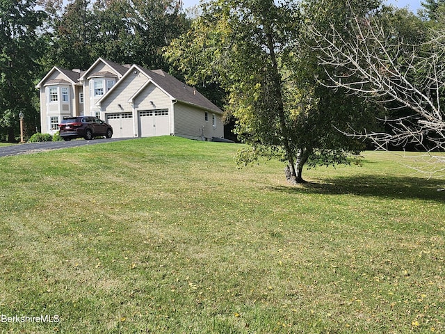 view of yard featuring a garage