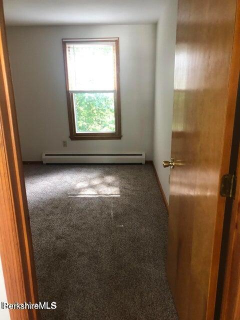 420-436 N Houghton St, Clarksburg, MA 01247 - carpeted empty room featuring baseboard heating
