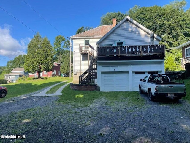 420-436 N Houghton St, Clarksburg, MA 01247 - view of front of property with stairway, driveway, a chimney, a garage, and a front yard