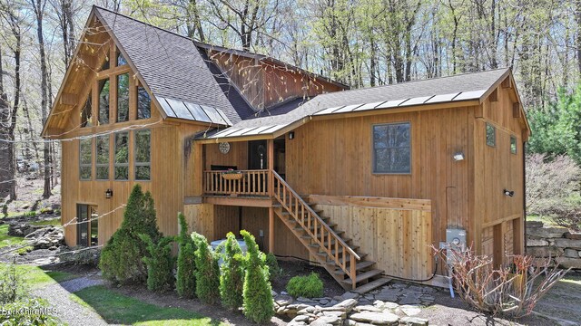 55 Mallard Dr, Becket, MA 01223 - view of property exterior with roof with shingles and stairs