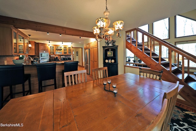 55 Mallard Dr, Becket, MA 01223 - dining room with a chandelier, stairway, and beam ceiling