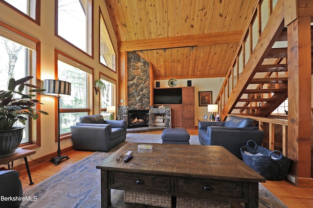 55 Mallard Dr, Becket, MA 01223 - living area featuring healthy amount of natural light, stairway, high vaulted ceiling, wood finished floors, and a wood ceiling with exposed beams