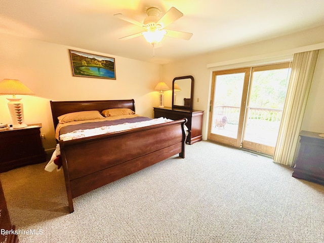 bedroom featuring access to exterior, ceiling fan, and light colored carpet