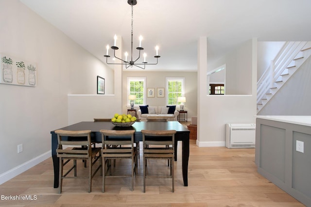 60 Parsley Ln, Sheffield, MA 01257 - dining space featuring light wood finished floors, a chandelier, baseboards, heating unit, and stairway