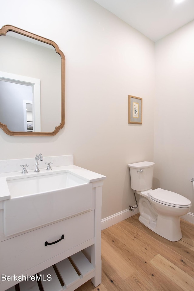 60 Parsley Ln, Sheffield, MA 01257 - half bath with vanity, toilet, wood finished floors, and baseboards