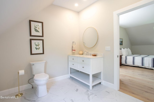 60 Parsley Ln, Sheffield, MA 01257 - bathroom with lofted ceiling, vanity, marble finish flooring, toilet, and baseboards