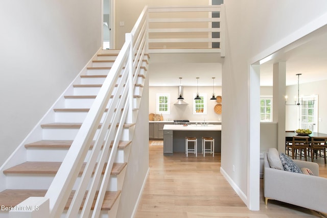 60 Parsley Ln, Sheffield, MA 01257 - stairs with wood finished floors, a chandelier, and baseboards