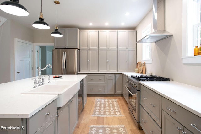 60 Parsley Ln, Sheffield, MA 01257 - kitchen with stainless steel appliances, wall chimney range hood, gray cabinets, a sink, and recessed lighting