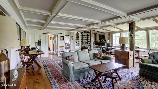 living room featuring beam ceiling, wood-type flooring, and coffered ceiling