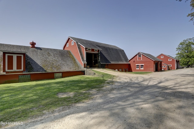 view of home's exterior with a lawn