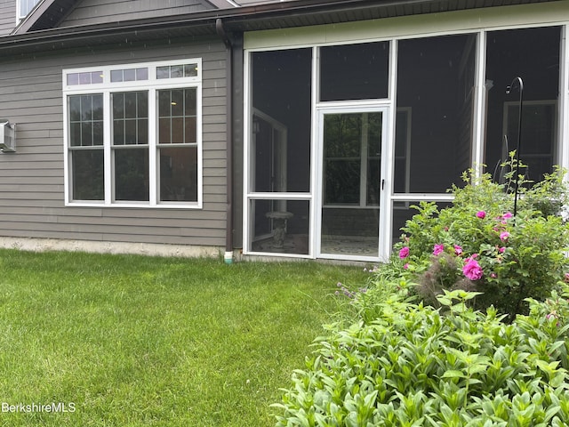 4 Evergreen Trl Unit 4, Lenox, MA 01240 - view of home's exterior with a sunroom and a lawn