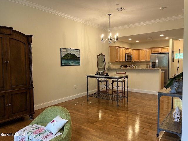 4 Evergreen Trl Unit 4, Lenox, MA 01240 - kitchen featuring stainless steel appliances, a peninsula, crown molding, dark wood-style flooring, and pendant lighting