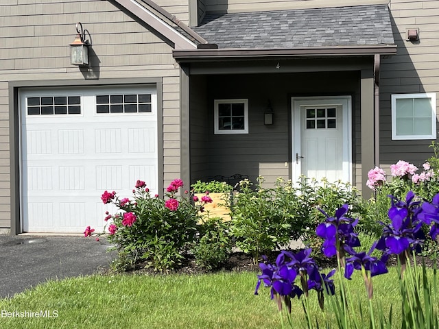 4 Evergreen Trl Unit 4, Lenox, MA 01240 - view of exterior entry with roof with shingles and a garage