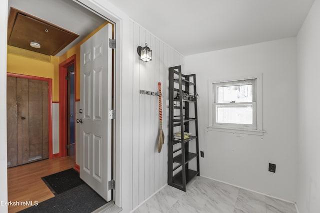 interior space featuring marble finish floor