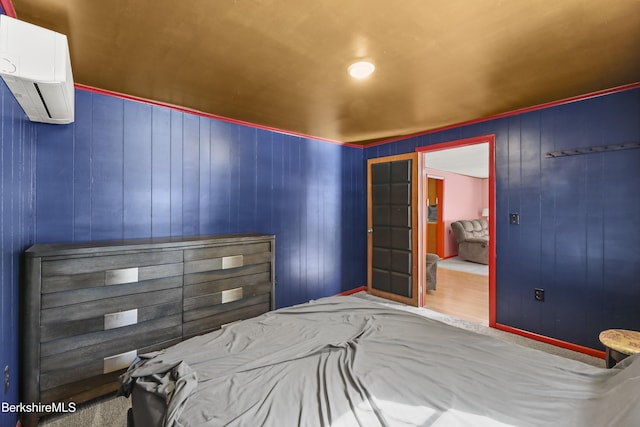 bedroom with a wall mounted air conditioner