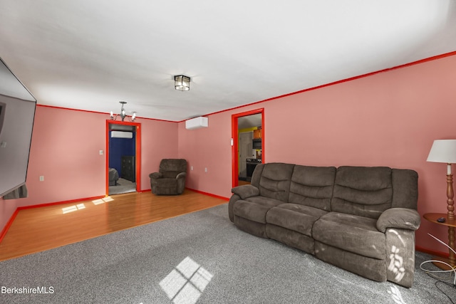 unfurnished living room with baseboards, ornamental molding, an AC wall unit, and wood finished floors